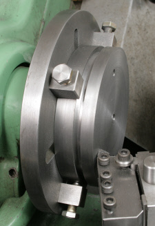 Faceplate dogs, used to postion a workpiece. The workpiece is secured using screws from the rear of the faceplate into tapped holes in the workpiece.
